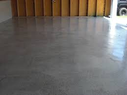 A Gray Epoxy With Black White And Gray Flakes Garage Floor A Gloss Topcoat Was Applied To Give It A Wet Look Garage Floor Flooring Garage Floor Epoxy