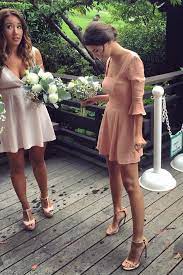 A casual dress and sneakers. Emily Ratajkowski Wears This Bridesmaid Dress Even Better Than A Bikini Wedding Guest Dress Celebrity Bride Best Wedding Dresses