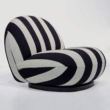 Buy boppy newborn lounger—original | lightweight plush chair with carrying handle | infant seat for awake time | wipeable and machine washable | black and white with gold hearts, hello baby on amazon.com free shipping on qualified orders Pacha Swivel Lounge Chair In Black White By Gubi At The Conran Shop