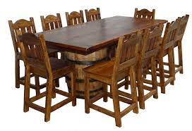 It also has a wrought iron foot rail. Wine Barrel Table Wine Barrel Table Barrel Table Farmhouse Dining Table