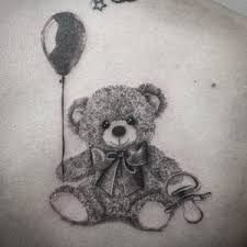 The name stuck, and today the teddy bear tattoo is symbol of innocence, love, affection, and childhood. Tattoo Uploaded By Alexandre Boulent Tatouage Tattoo Famille France Family Animal Teddybear Cross 828068 Tattoodo