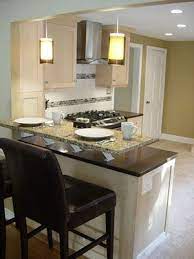 Light Cabinets And Raised Breakfast Bar