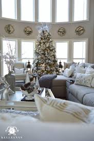 Two Story Living Room With Neutral Silver And Gold Christmas Decor And Large Silver A Christmas Decorations Living Room Christmas Room Christmas Living Rooms