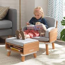 The ottoman has a tongue shaped pouf with an upholstered top that sits on a round base. Mid Century Kids Reading Chair Ottoman In 2021 Kids Seating Kids Chairs Kids Reading Chair