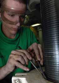 File:US Navy 080112-N-9639L-009 Aviation Support Equipment Technician 3rd  Class Alex Pinkney removes a snap ring while disassembling a hydraulic jack  in the ground support equipment shop aboard the Nimitz-class  nuclear-powered aircr.jpg ...