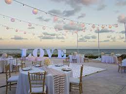 White And Gold Accents And An Ocean View For This Wedding Recep Hard Rock Hotel Riviera Maya Hard Rock Hotel Cancun Wedding Beach Wedding Decorations Reception