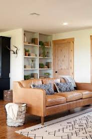 Showcasing a tufted back and arms with fabric buttons over a gold metal base frame, this couch is ideal for anyone who wants. Fixer Upper A Family Home Resurrected In Rural Texas Farm House Living Room Living Room Remodel Living Room Interior