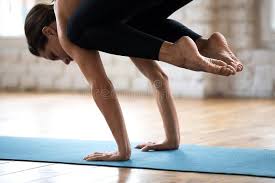 Squat down from tadasana with your inner feet a few inches apart. Sporty Woman Practicing Yoga Doing Exercises To Strengthen Feet Stock Photo Image Of Person Pilates 131137536