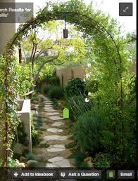 Curved Overhead Trellis This Could Be Part Of A Greenhouse Frame Way Into This Lantern Mediterranean Landscaping Narrow Garden Landscape Design