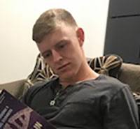 ROTC student in step with walking ... and reading