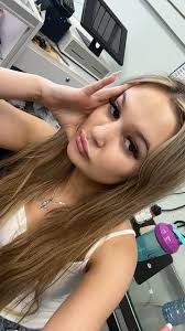 Who can color correct and bring back natural brunette hair color in Muncie?