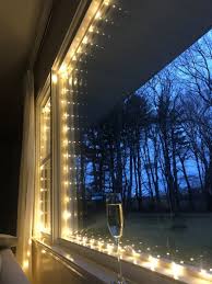 Opening fuse door in a christmas light plug. Easy Magical Christmas Window Lights With Fairy String Lights The Well Dressed Table