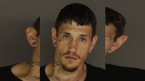 Man arrested after strangling, assaulting family member, police say