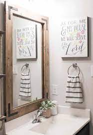 This tile went on without any grout and matched the blue bathroom. Diy Bathroom Mirror Frame Without Removing Mirror Clips Her Happy Home
