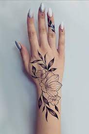 This tattoo consists of half skull with red eyes and nose region. 25 Awesome Hand Tattoo Designs For 2021 The Trend Spotter