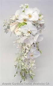A Contemporary Cascading Wedding Bouquet Of Phalaenopsis Cymbidium And Dendrobium Orchids W Orchid Bouquet Wedding White Orchid Bouquet Flower Bouquet Wedding
