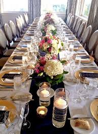 Navy And Gold Wedding Table Decor With White And Pink Flowers Gold Chargers And Floating Candl Wedding Table Flower Centerpieces Wedding Wedding Centerpieces