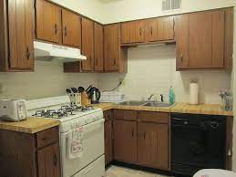 If your kitchen isn't in need of a complete overhaul, but still doesn't fit your style, simply painting the cabinets or replacing the floors can make a huge difference. Rental Apartment Kitchen Makeover Hometalk
