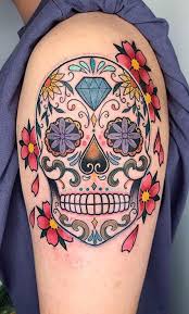 While, roses are inked to bring oomph factor to the decorative skulls, and bring into limelight a soothing visual artistry by the tattoo artist; 100 Unique Sugar Skull Tattoos Designs Ideas Tattoo Me Now