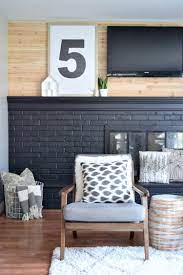 It all makes for one glam living room. How To Paint Your Brick Fireplace Black And Never Look Back