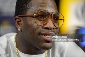 Lanell Bellows and Matthew Garretson are kept apart by referee Kenny...  News Photo