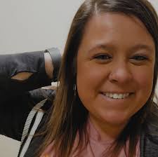 Who in Elyria can make keepsake sweaters from children's outgrown clothes?