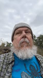 Cataloging the old shirts for new book.