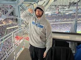 Eminem & Daughter Hailie Jade Attend Detroit Lions Game: Photos