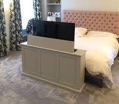 The trend for decluttering has grown especially in smaller living spaces. Pin By Andrea Whalen On Master Bedroom Tv Lift Cabinet Hidden Tv Bedroom House Furniture Design