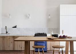 The dark hue plays beautifully with the green glimmers in the white marble counter tops and natural wood floors. The 11 Kitchen Trends In 2021 That Are Both Very Exciting And Totally User Friendly Emily Henderson