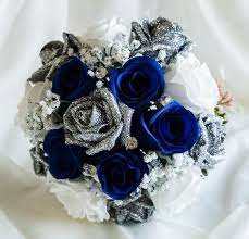 They will stay in great condition for years and be a reminder about this day. A Hand Made Wedding Bouquet Made With Artificial Flowers This Lovely Bouquet Comprises Of 5 N Blue Wedding Flowers Blue Silver Weddings Wedding Bouquet Ribbon