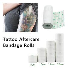 My tattooist told me you only keep the bandage ( cling film ) on until you get home and clean it. Tattoo Aftercare Film Dressing Protective Waterproof Adhesive Clear Second Skin Bandage Rolls Cling Film Tattoo Care Supplies 10cm 15cm 20cm From Dllprotection 13 32 Dhgate Com