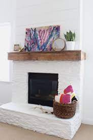 Our floor to ceiling fireplace makeover involved we paired the warm grey tile with sanded grout in snow white by polyblend. Pin On Blogger Home Projects We Love