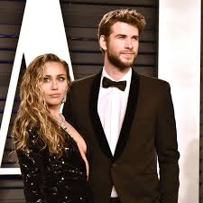 Liam hemsworth makes an adorably awkward appearance in the cyrus christmas photo. How Miley Cyrus And Liam Hemsworth Reportedly Feel About Each Other 8 Months After Their Breakup Glamour