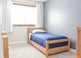 The headboard and footboard of the twin daybed are mirror images of each other with a frame and panel look. Diy Basic Twin Bed