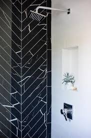 Black And White Accent Wall Bathroom Glam Bathroom A Walk In Shower Boasting An Accent Wall Clad In Black Marble Herringbone Tiles Transitional Decor Glamorous Bathroom Transitional Decor Kitchen