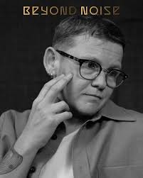 VOICES: KAE TEMPEST BY DANA LIXENBERG FOR BEYOND NOISE ISSUE 2. Slide 1:  Shirt by #BottegaVeneta by @matthieu_blazy. Glasses, Kae's own. Slide 2:  Jacket by @hermes. Trousers by @officinegenerale. T-Shirt by @dunhill.