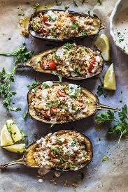Couscous Stuffed Eggplant Topped With A Fresh Lemon Tahini Sauce Is A Delicious Way To Serve Eggplants Vegan And Da Recipes Eggplant Recipes Vegetable Recipes