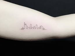 Luster for a fine grain pebble. Nyc Skyline Tattoo