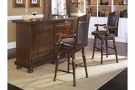 The Porter Bar From Ashley Furniture Homestore Afhs Com The Warm Rustic Beauty Of The Porter Dining Room Collection Uses A Deep Finish And Or Casas Casitas
