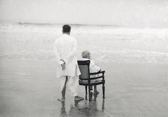 1944: Mahatma Gandhi with his son Devdas at the Juhu Beach, Mumbai.