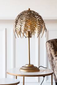 Floor lamp designed and manufactured in france, 1970s decorative gold metal palm leaf design with an opaque glass spherical shade. Fern Leaf Palm Tree Style Table Lamp Rockett St George