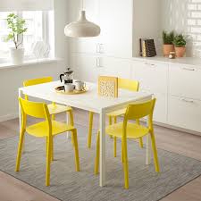 Dining tables are hot spots even when there's no food on them. Melltorp Janinge White Yellow Table And 4 Chairs Ikea