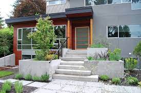 17 Ways To Increase Your Home S Curb Appeal Modern Exterior Concrete Planters Porch Design
