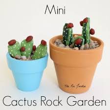 These arrangements are crazy cute when you're satisfied with the color of your rocks, use paint pens to add the cactus details. Cactus Rock Garden