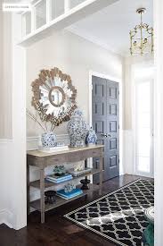 In this foyer, a blue geometric rug stretches from wall to wall, delivering a big dose of personality right inside the front door. Front Entryway Decorating Ideas For Every Season