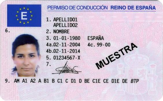 Spanish Permiso de Conducir card resting alongside a Highway Code manual on a wooden table Spain - ES4 - Mobility & Transport - Road Safety - European Commission. how to get a driving license in Spain