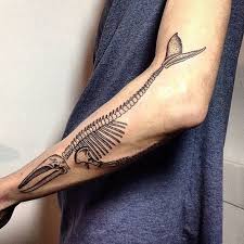 Black Ink Whale Skeleton Tattoo On Left Arm Jpg 500 500 Evolution Tattoo Tattoos Science Tattoos