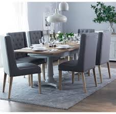 It comes in two colors—honey, which is a rich brown, and a taupe color called grey wash—and is made from sustainable mango wood. Mottistone 1 6m Extending Table And 6 Button And Studded Dining Chairs Furniture From Readers Interiors Uk