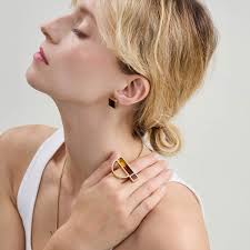 Geometric ring with amber and spider engraving from the Baltica collection